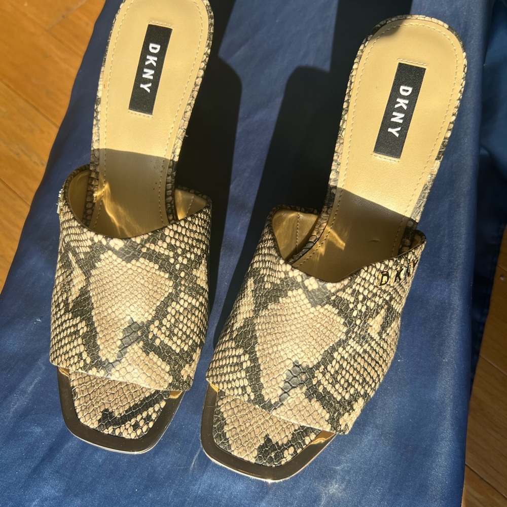 NEVER WORN! Classy, sassy animal print DKNY 3” heels! Metal toe tips. Size 10.